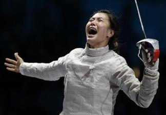 South Korea's Jiyeon Kim celebrates winning against Russia's Sofya Velikaya at the end of their women's sabre individual gold medal fencing match at the ExCel venue during the London 2012 Olympic Games August 1, 2012. Credit: Reuters/Max Rossi 